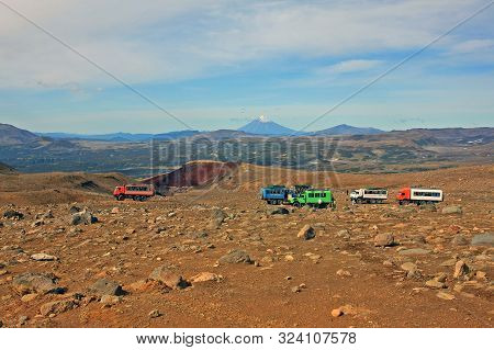 Kamchatka Peninsula, Russia -- 13 September 2019: Tourists In The Hills In Kamchatka. Travel In Thes