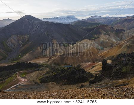 Colorful Rhyolit Rainbow Mountain Panorma With Multicolored Volcanos And Geothermal Lake And Snow Co