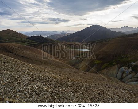 Colorful Rhyolit Rainbow Mountain Panorma With Multicolored Volcanos. Sunrise In Landmannalaugar At 
