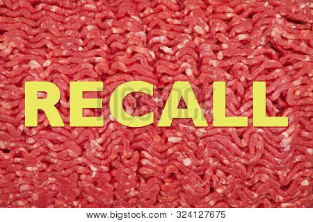 Yellow Recall Warning Message On Close-up Of Raw Ground Beef