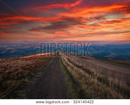 Mountain Trail, Hiking Road On Sunset Sky Background, Travel And Toursm In The Wild Nature