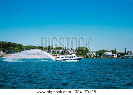 Mackinac Island Mi /usa - July 9th 2016: Star Line Ferry Taking Off Across Lake Michigan From St. Ig