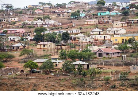 Colorful Huts And Housing Scattered Informally On Steep Hillside In South Africa