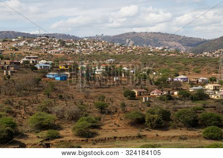 Housing And Huts Scattered Informally Over Hilly Area In Rural South Africa