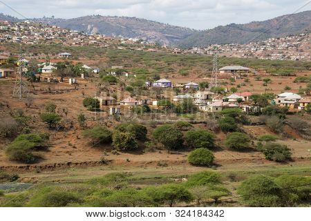 Housing And Huts Scattered Informally Over Hills In Rural South Africa