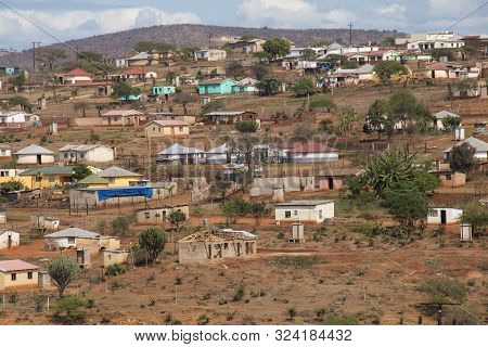 Housing And Huts Scattered Informally On Hill In Rural South Africa