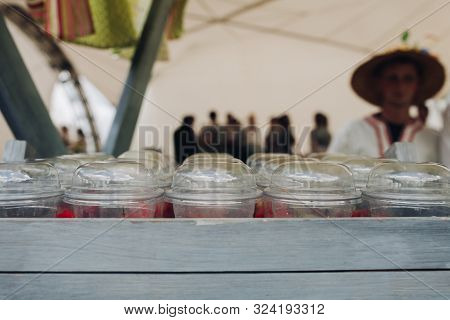 Organic Veggies In Cups To Go.close-up Of Loads Of Plastic Cups Filled With Chopped Vegetables And S