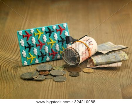 lugagge shape saving jar on the wooden table