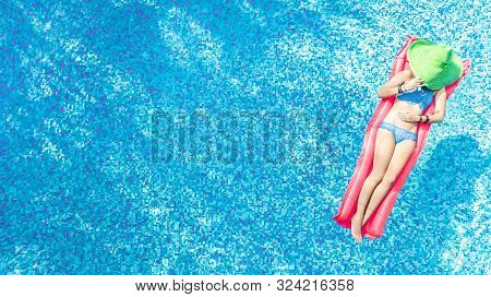 Beautiful Young Woman In Hat In Swimming Pool Aerial Top View From Above, Young Girl In Bikini Relax