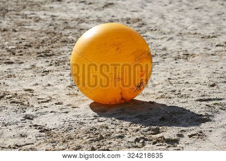 Yellow Colored Physioball On The Sand During  Training For Beginner Riders And Horses At Rural Ridin