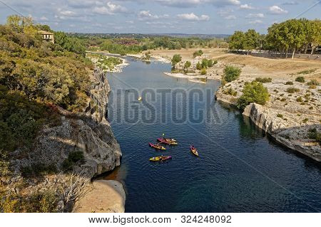 Remoulins, France, September 20, 2019 : Kayaking Under The Pont Du Gard, The Highest Roman Aqueduct 