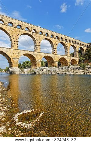 Remoulins, France, September 20, 2019 : The Pont Du Gard, The Highest Roman Aqueduct Bridge, And One