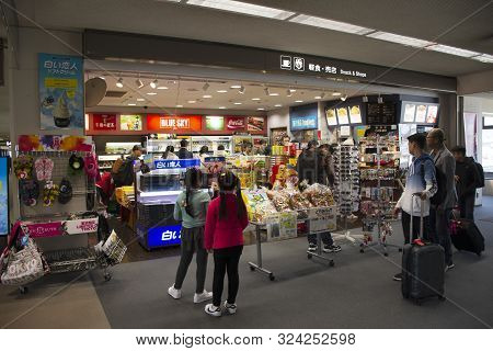 Japanese People And Foreigner Travelers Look And Buy Food And Souvenir Gift At Small Convenience Sho
