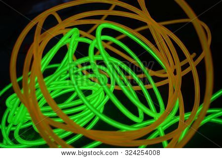 Bright Luminous Yellow And Green, Lime Neon Wires In Different Formats And Layouts. An Electrolumine