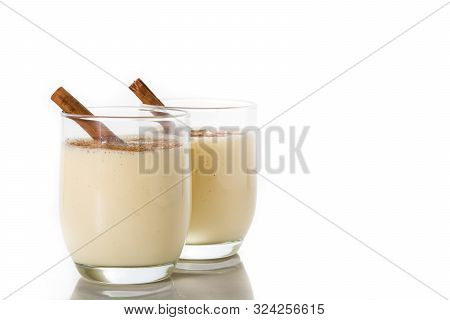 Homemade Eggnog With Cinnamon In Glass Isolated On White Background. Typical Christmas Dessert.copy 