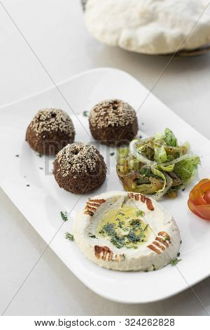 Organic Falafel And Hummus Starter Snack Food Mezze Platter On White Table
