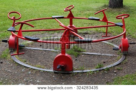 A Ring With Red Toy Bicycles In Metal At The Playground At Grubbe In Umea