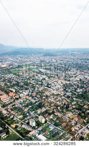 Aerial View Of City Graz From Helicopter Drone With Districts Eggenberg And Wezelsdorf On A Cloudy S
