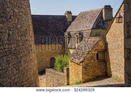 The medieval town of Beynac rising on a limestone cliff above the Dordogne River. France, Dordogne department, Beynac-et-Cazenac