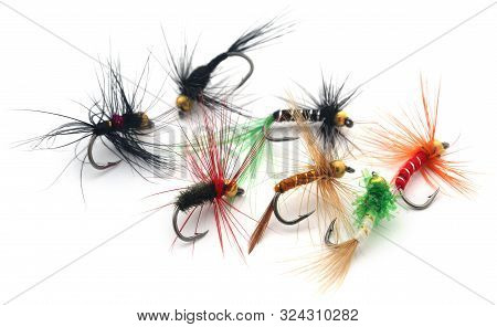 Fishing Flies Of Diffrent Colors With Hooks Over White Background