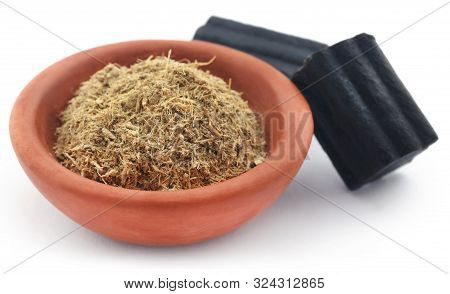 Liquorice Powdere With Candy Over White Background