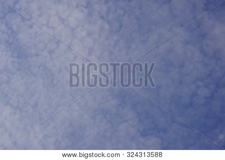 Light White Clouds In The Blue Sky.
