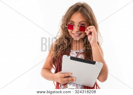 Pretty Girl Holding Light Grey Tablet Touches Square Red Sunglasses On Her Face Isolated