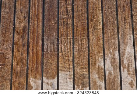 Old Wet Wooden Yacht Deck With Vertical Parallel Lines