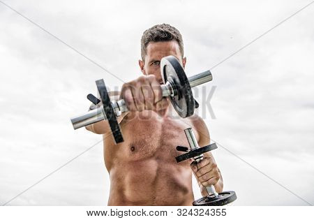 Sport Gives Energy. Success. Perfect Biceps. Muscular Man Exercising In Morning With Barbell. Athlet