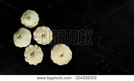 Five White Pattypan Squash Heads On Dark Marble Like Board, Wide Banner With Space For Text Right Si