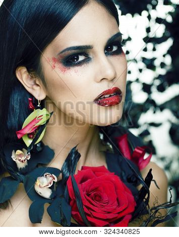 Pretty Brunette Woman With Rose Jewelry, Black And Red, Bright Make Up Kike A Vampire Closeup Red Li