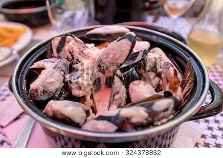Closeup Of Traditional Dish Of French Cuisine, Appetizing  Mussels With Sauce In Pyla-sur-mer. Franc