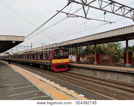 Jakarta, Indonesia - August 8, 2019: A Commuter Line Train Arrives At Bojong Indah Station.