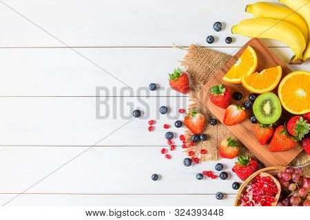 Mixed Fresh Fruit Salad With Strawberry, Blueberry, Orange On Wooden White Background. Diet Fruits C