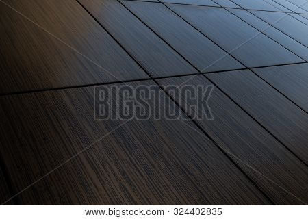 Diagonal View Of Dark Brown Venge Tile Wall Surface, Wood Imitation Texture.