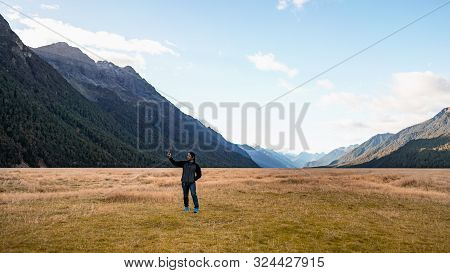 A Tourist Selfie With The Smartphone To Capture The Beautiful Landscape Scenic View Of Ellington Val