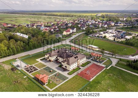 Aerial View Of New Prescool Building In Residential Rural Area.