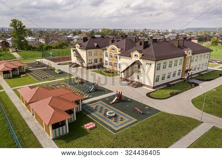 Aerial View Of New Prescool Building In Residential Rural Area.