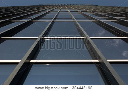 Bottom View Of Blue Mirrorlike Skyscrapers Wall
