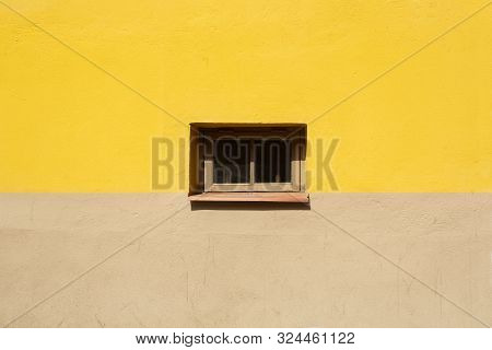Colorful Wall Fragment With Small Window In The Middle Background. Yellow And Beige House Wall On Su