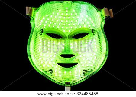 Light Rejuvenating Mask For Facial Skin Therapy On Black Background