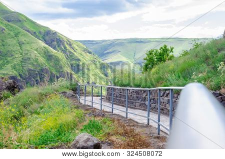 Panoramic View Of Vardzia Cave Monastery Town. View From The Monastery To The River Valley And Green