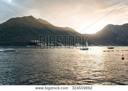 Beautiful View Of The Kotor Bay In Montenegro At Sunset. Natural Mountain Landscape And Sea With Boa