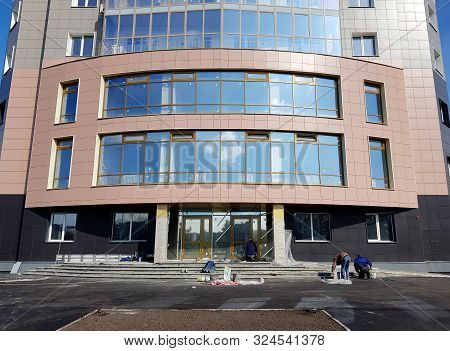 Novokuznetsk, Russia - 09.27.2019. Working People - Builders Are Engaged In Finishing The Area Aroun