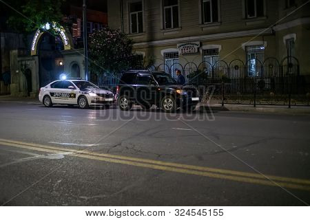 Tbilisi, Georgia - June 29 2019: A Police Officer Stopped A Car To Check Documents, Clarify The Circ