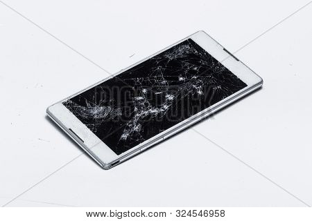 Broken Mobile Phone With Cracked Screen White