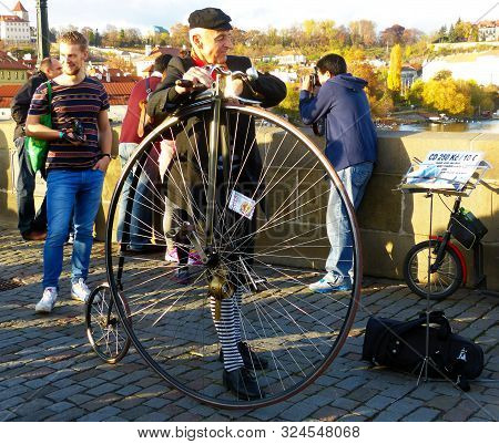Prague / Czech Republic - November 7, 2015: Cyclist With An Antique Bicycle And Traditional Costume 