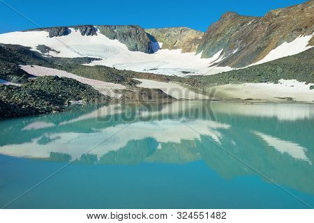 Mountain Lake At The Foot Of The Igan Glacier On A Sunny August Day. Polar Ural, Russia