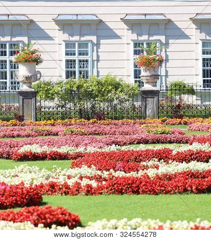 Salzburg, S, Austria - August 27, 2016: Public Park With Flowers And The Old Palace