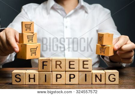 A Man Holds Boxes Over The Inscription Free Shipping. Promotions Preferential Terms For Large Custom